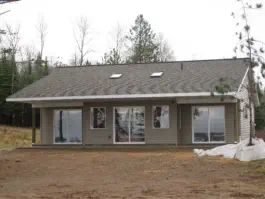 one story, gray home with three sliding doors