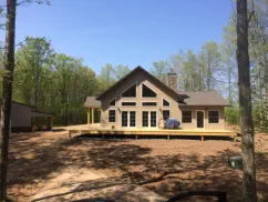 home with large deck and a-frame windows