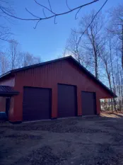 steel pole building with three large doors